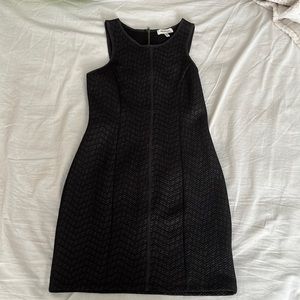 Simple black dress with some pattern all over